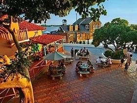 Outdoor dining area at Seaport Village near La Pensione Hotel