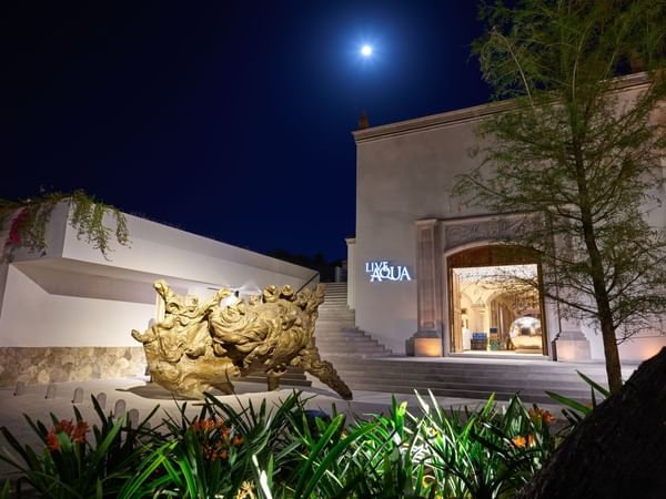 Exterior of live aqua hotel entrance at night