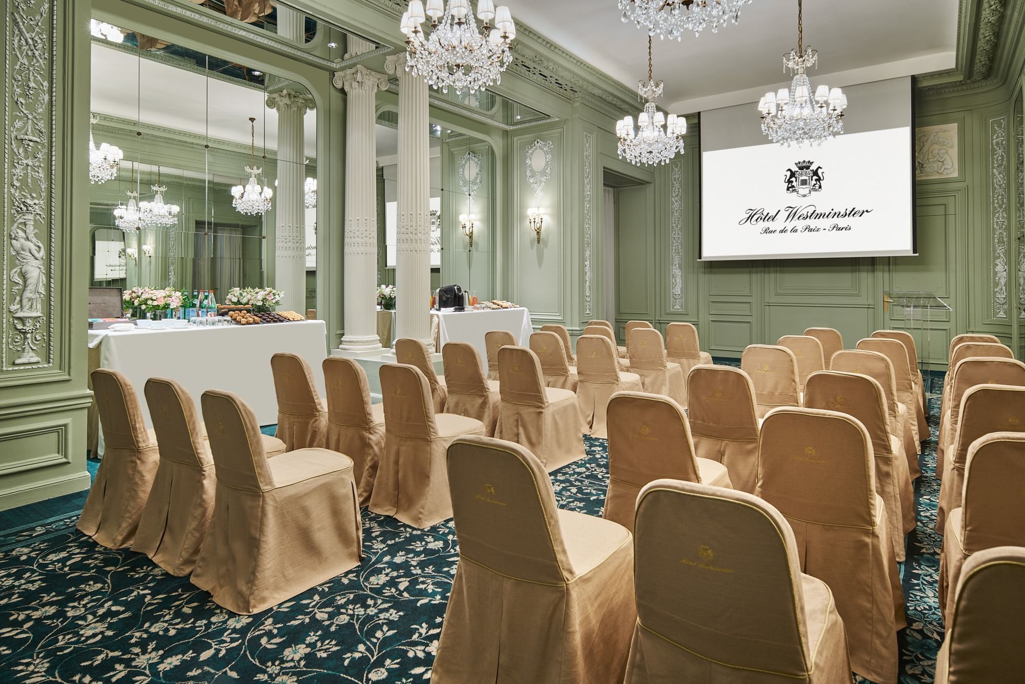 Elegant interior of Récamier meeting room with classroom chair set up and large screen at Hôtel Westminster - Paris