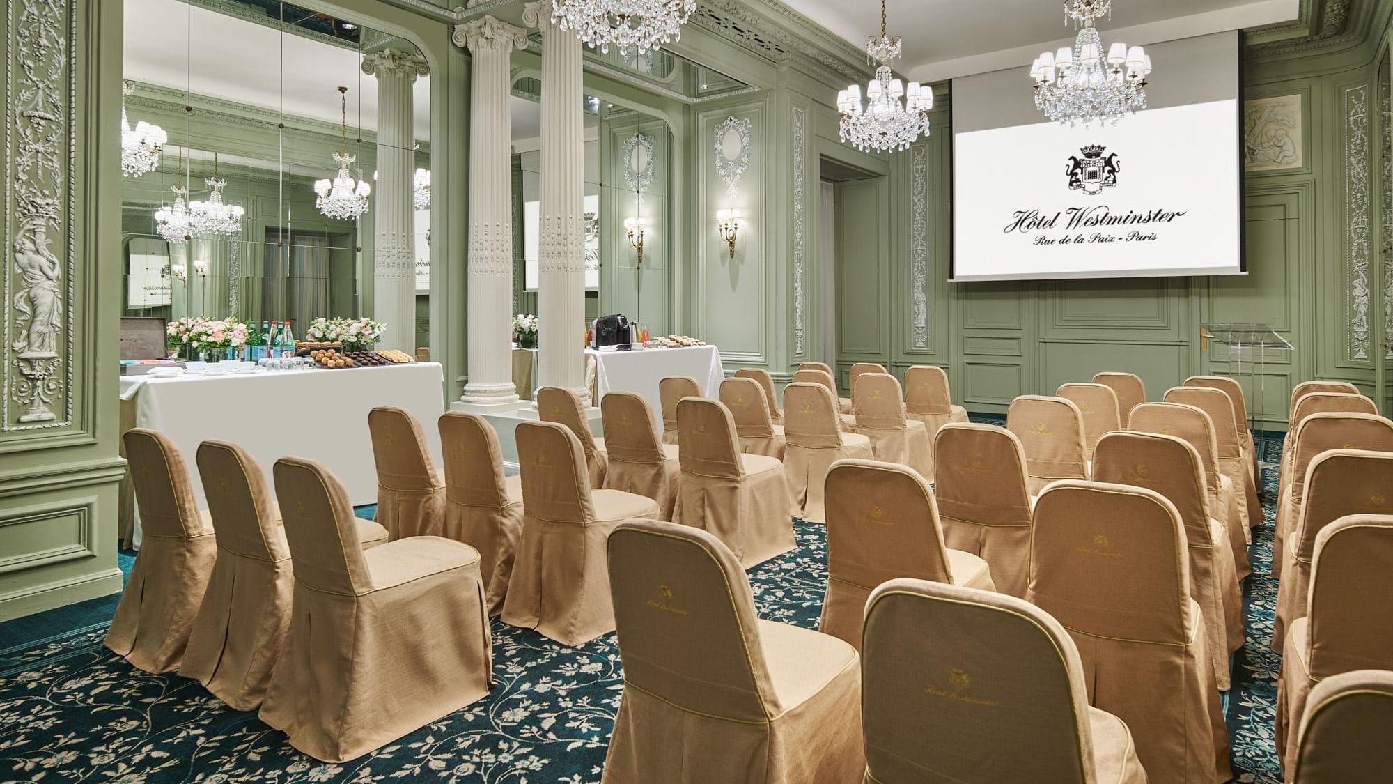 Elegant interior of Récamier meeting room with classroom chair set up and large screen at Hôtel Westminster - Paris