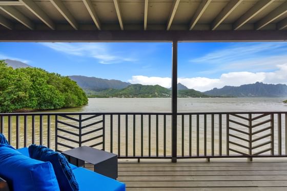 Balcony lounge area in One-Bedroom Waterfront Cottage at Paradise Bay Resort