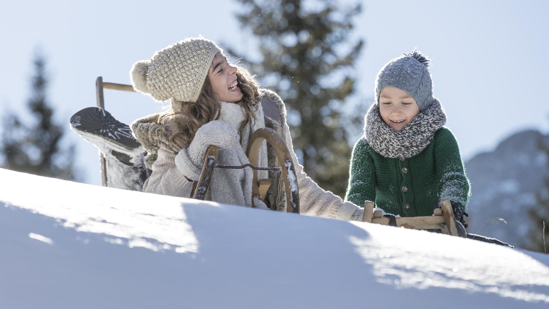 Kids playing on snow near Falkensteiner Hotel Sonnenalpe