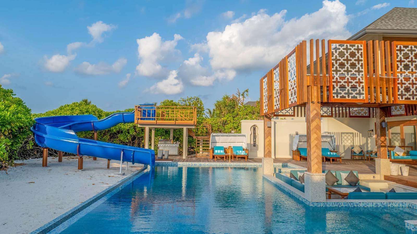 The pool with a slider at The Signature Collection by Hideaway