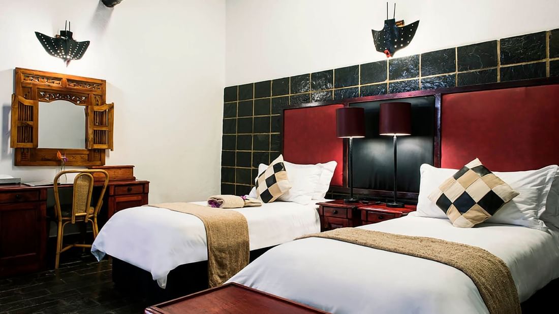 Double beds with a dressing table in Standard Room at Kedar Heritage Lodge, Conference Centre & Spa