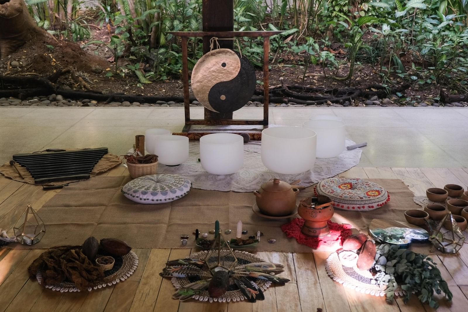 Setup in Lahari Wellness Center featuring Yin Yang gong, crystal singing bowls, and ritual items at Cala Luna Boutique Hotel