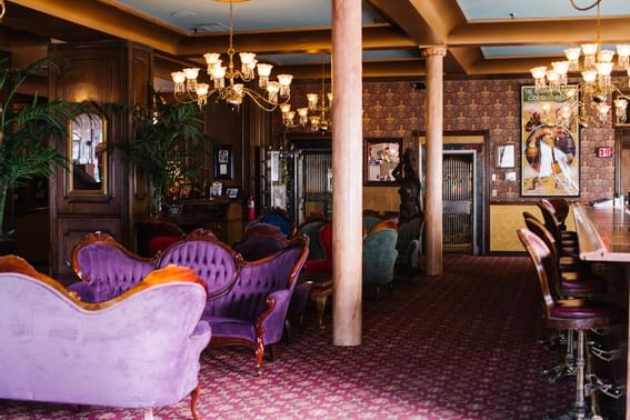 Lobby area with chandelier at Hay Creek Hotels