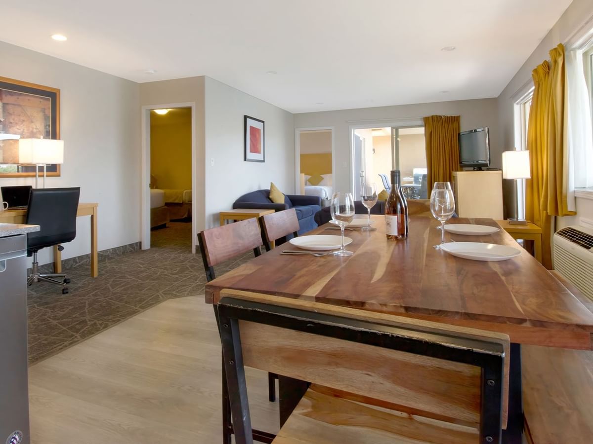 Dining table and living room of hotel suite