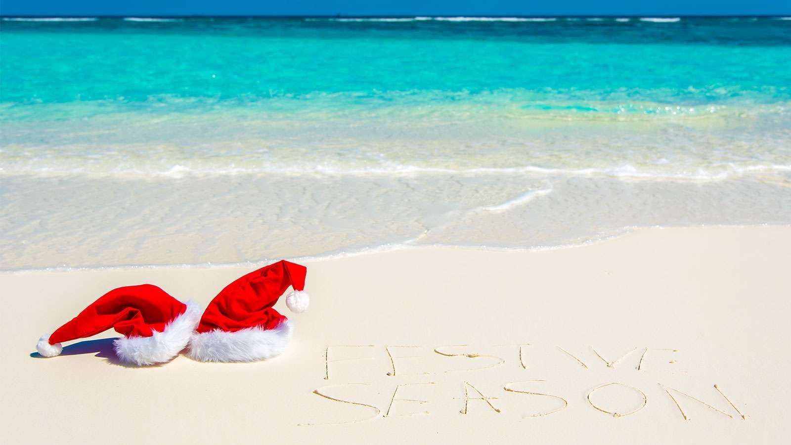 Xmas hats lying by the beach near The Signature Collection