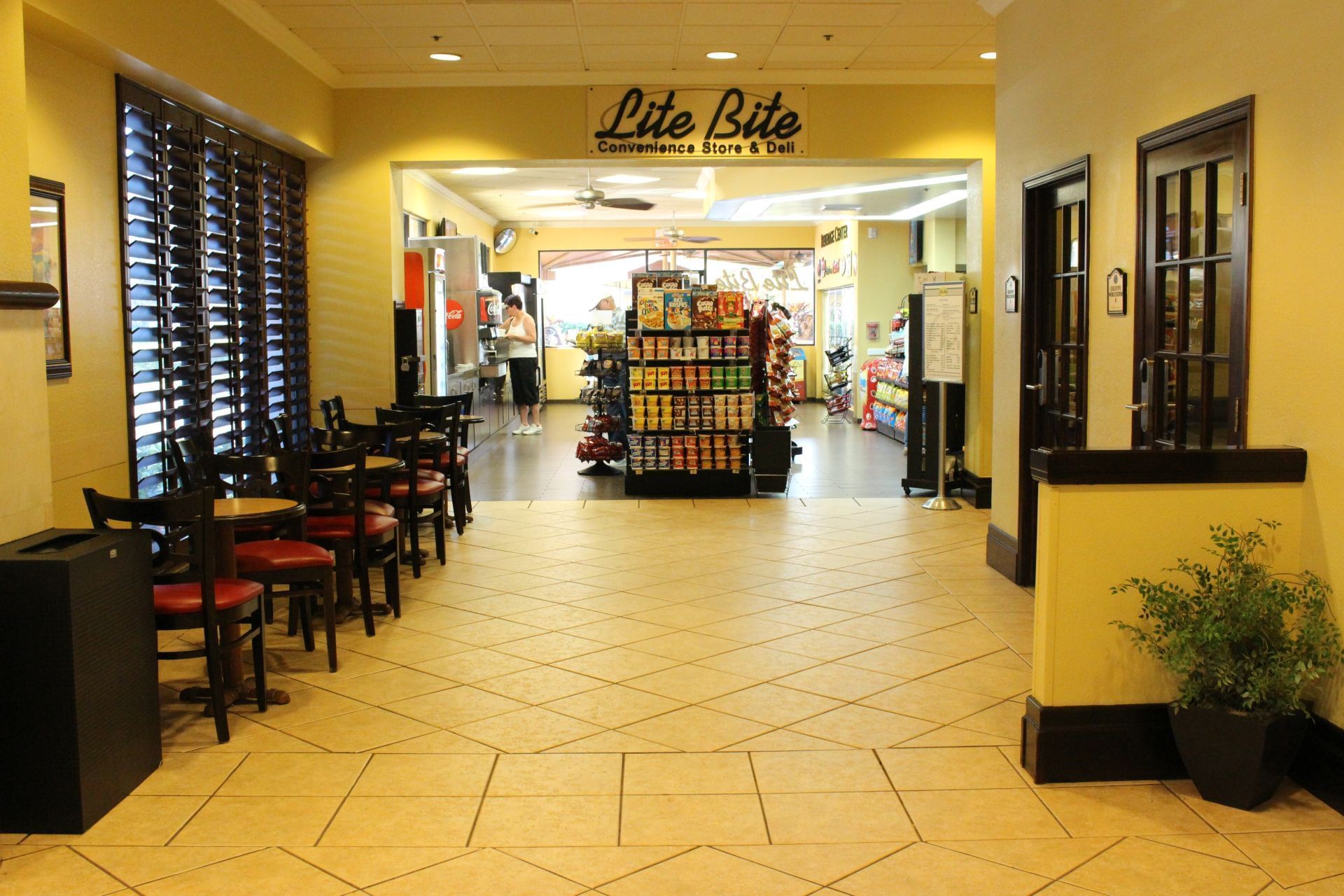 A convenience store with seating area