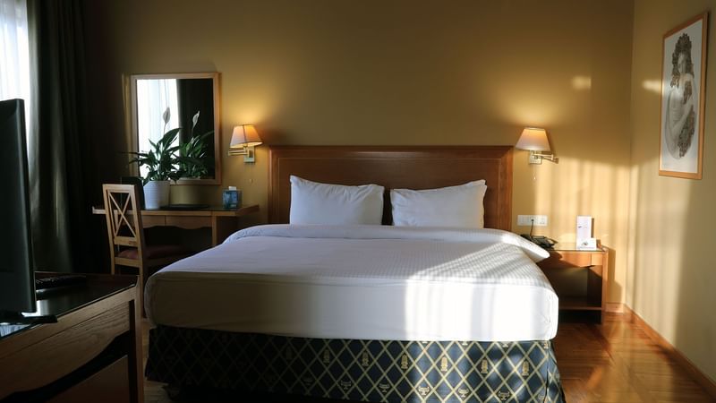 Dresser by the king bed in Junior Suite at Warwick Palm Beach Hotel - Beirut