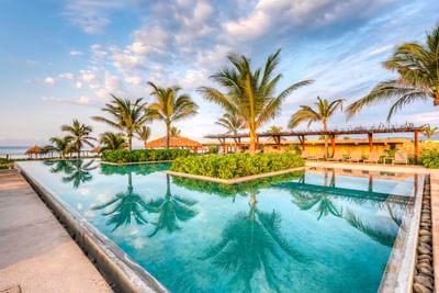Sunbeds by the pool with a sea view, Marea Beachfront Villas