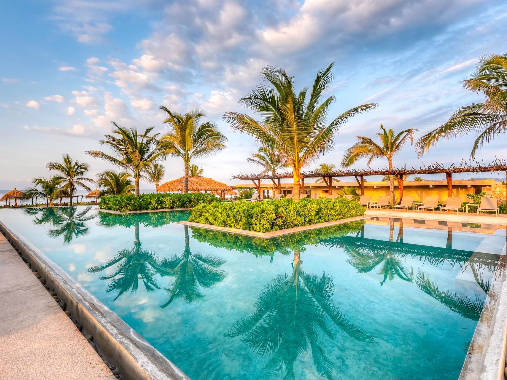 Sunbeds by the pool with a sea view, Marea Beachfront Villas