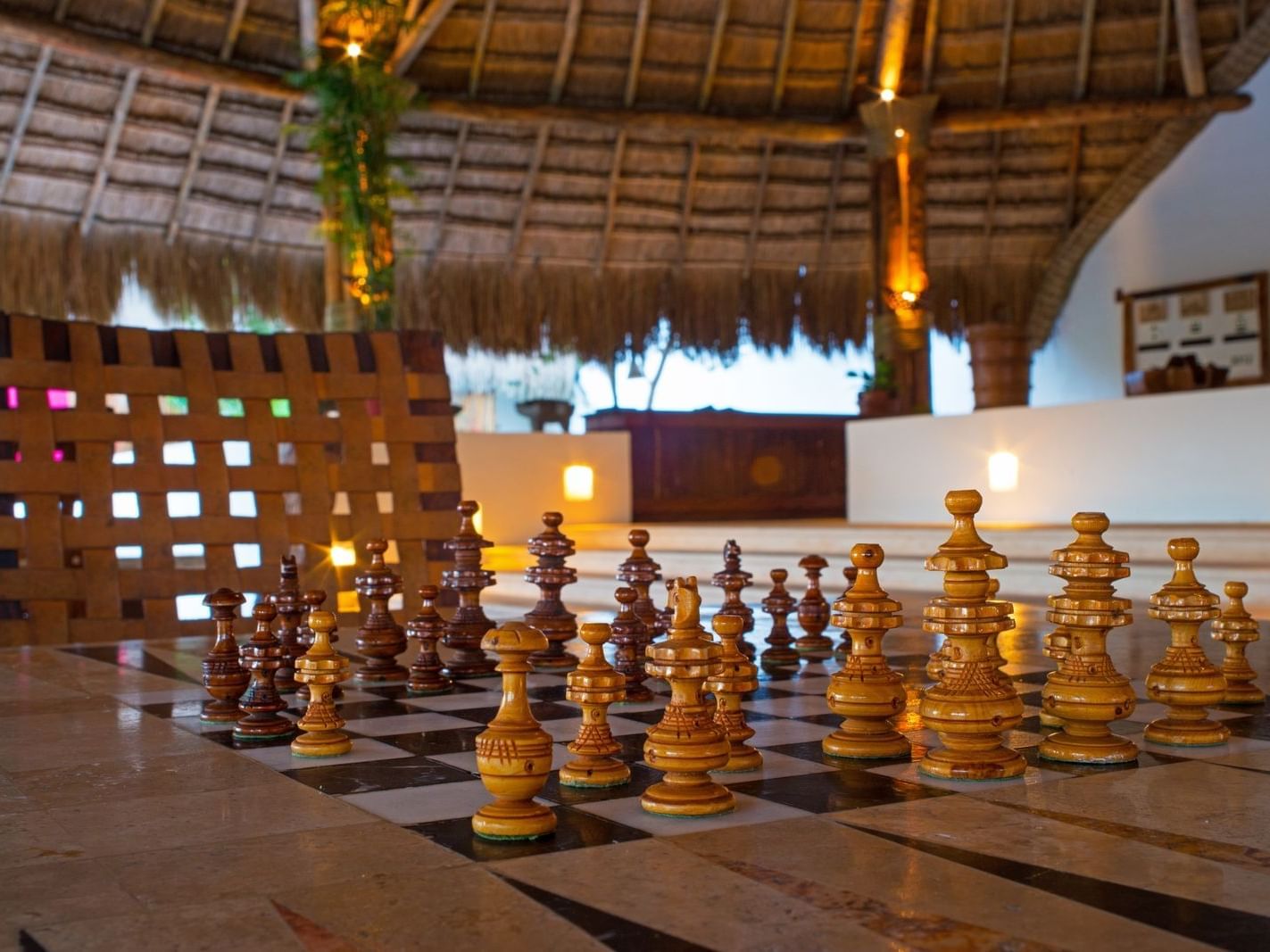 Lobby area decorated with chess pieces at La Colección Resorts