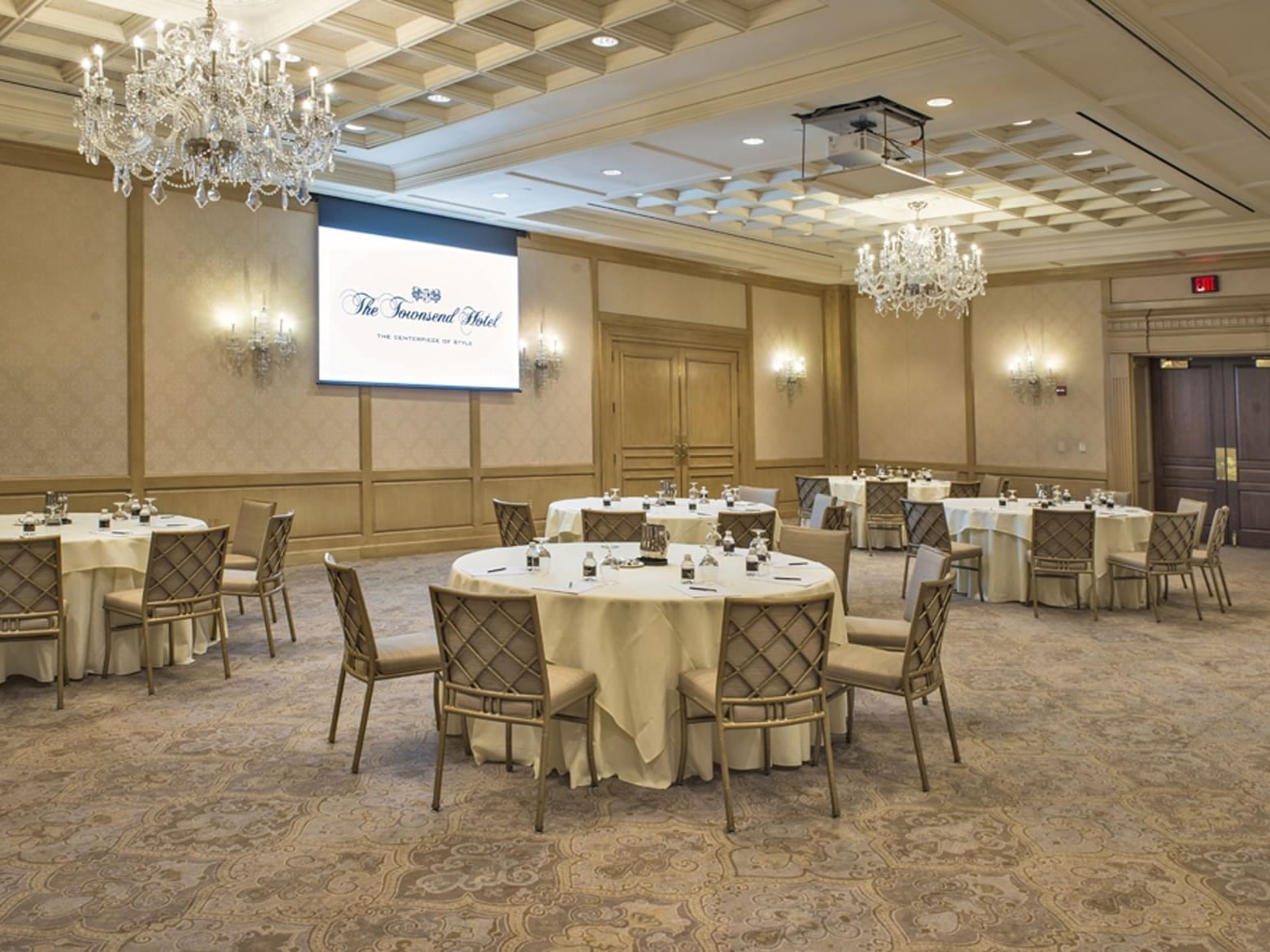 Round meeting tables arranged in Salon IV at The Townsend Hotel