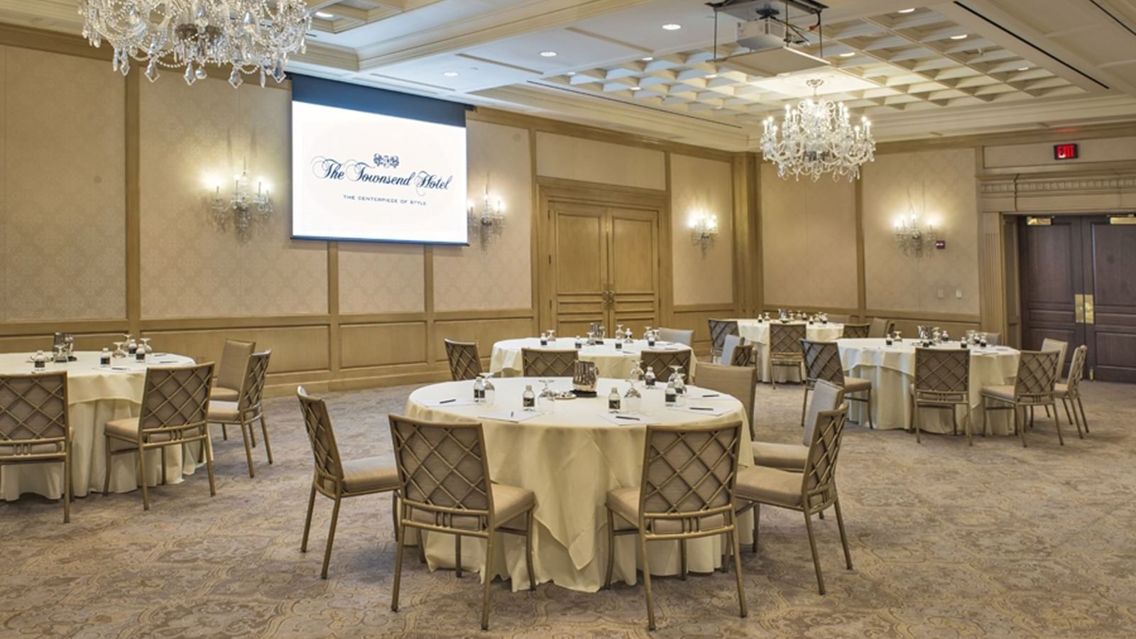 Round meeting tables arranged in Salon IV at The Townsend Hotel