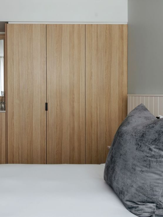 Village Balcony Queen at Elysium Manly with a wooden wardrobe by a mirrored dresser, best places to stay in Manly