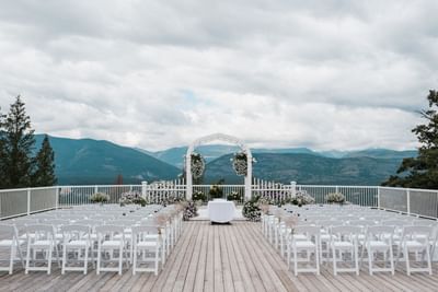 White seatings arranged for outdoor wedding at Fairmont Hot Springs Resort