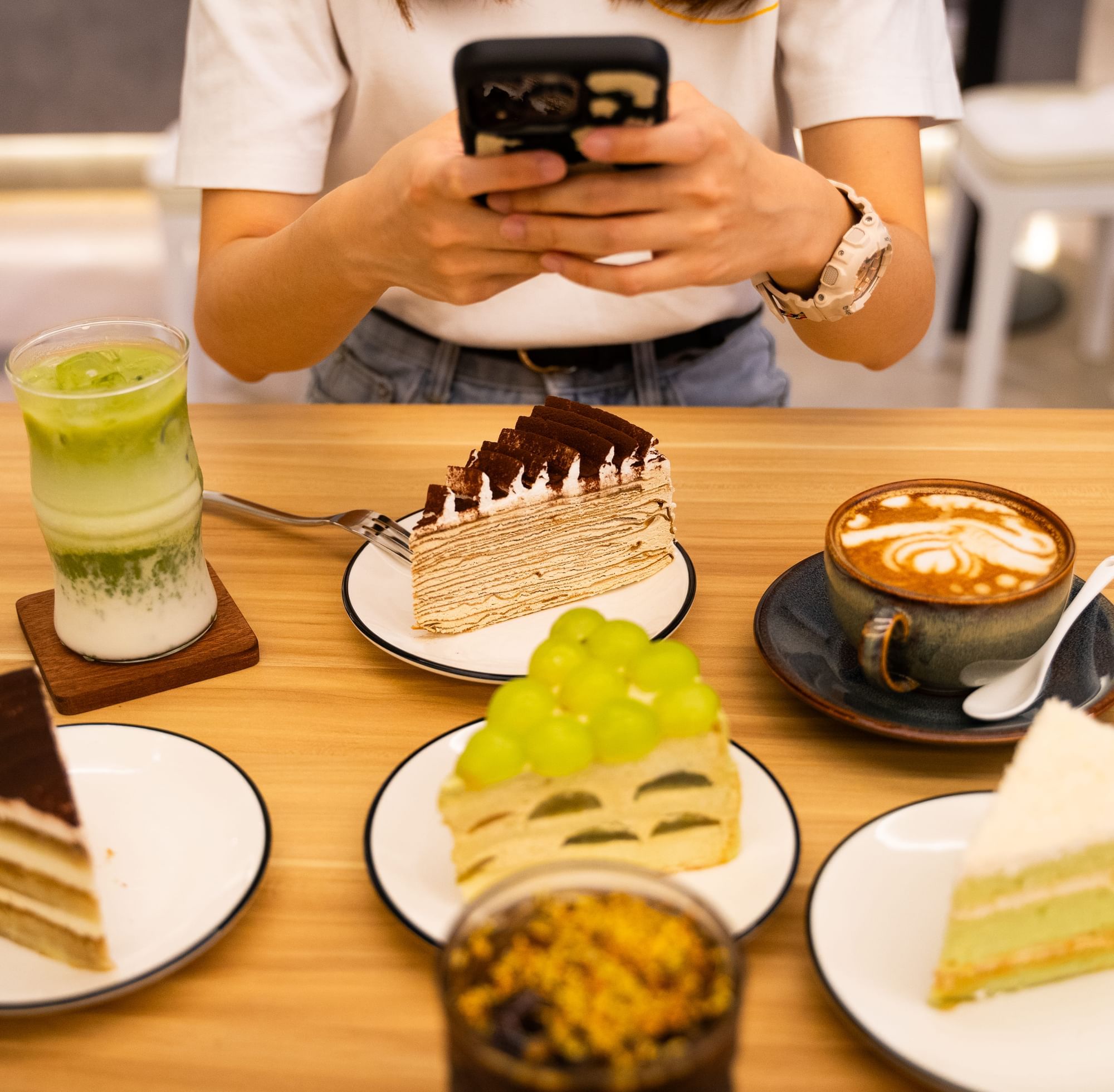 A woman capturing a photo of meals in Sunway Boulevard 88 near Sunway Big Box Hotel