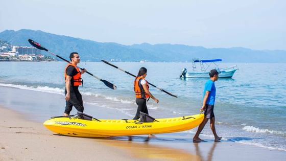 People Kayaking on the beach at Buenaventura Grand Hotel