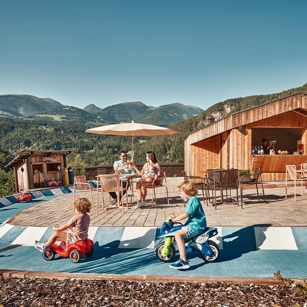 Family enjoying drinks and lounging at Falkensteiner Family Resort Lido