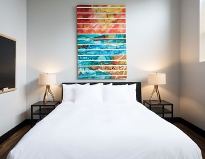 bed with colorful artwork