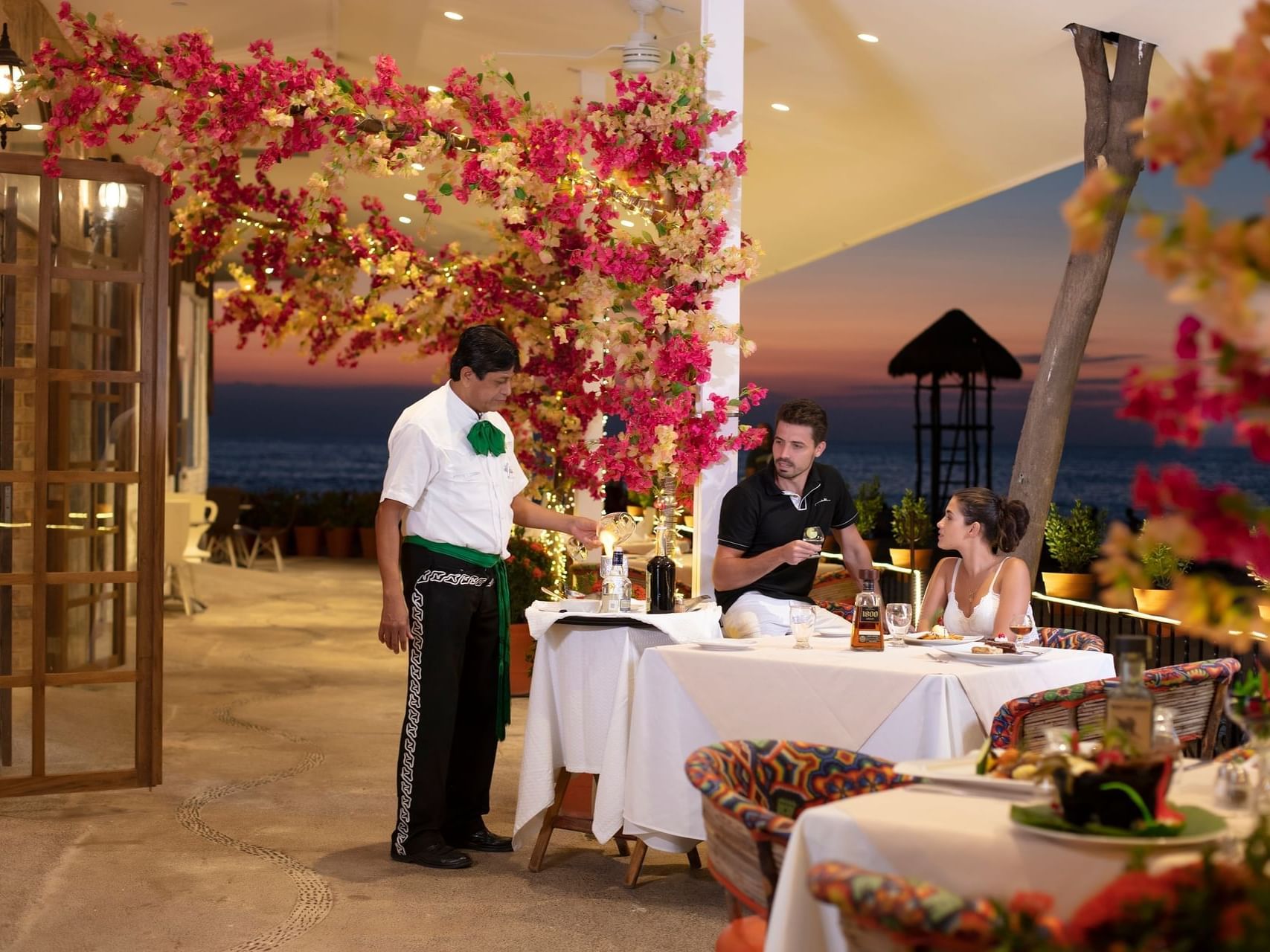 Couple dining in El Agave Restaurant at Los Arcos Suites