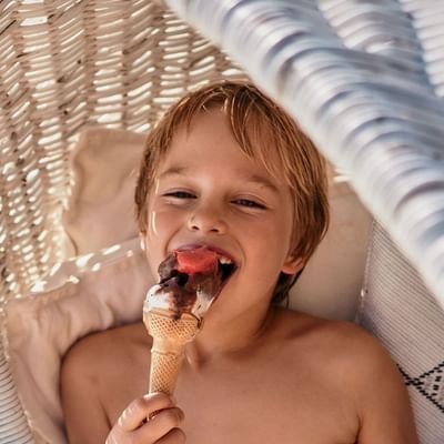 Photo of boy enjoying an ice-cream at Falkensteiner Hotels