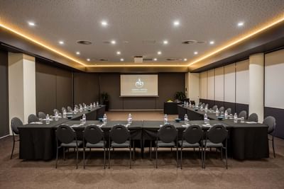U shaped table set-up, screen, conference hall at Amora Hotel