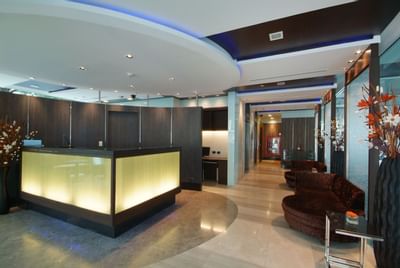 Lobby area with front desk at Amora Neoluxe Hotel Bangkok