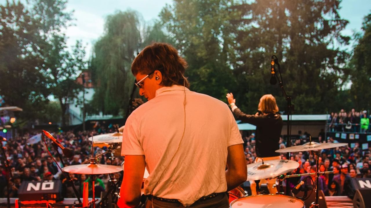 A drummer on stage during an outdoor festival in Canmore.