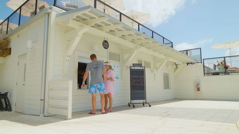 A couple ordering from Beach Cow at WaterColor Beach Club