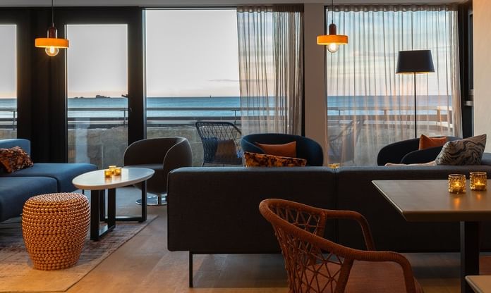 Interior & decor of a lounge area with ocean view at Oceania Hotels