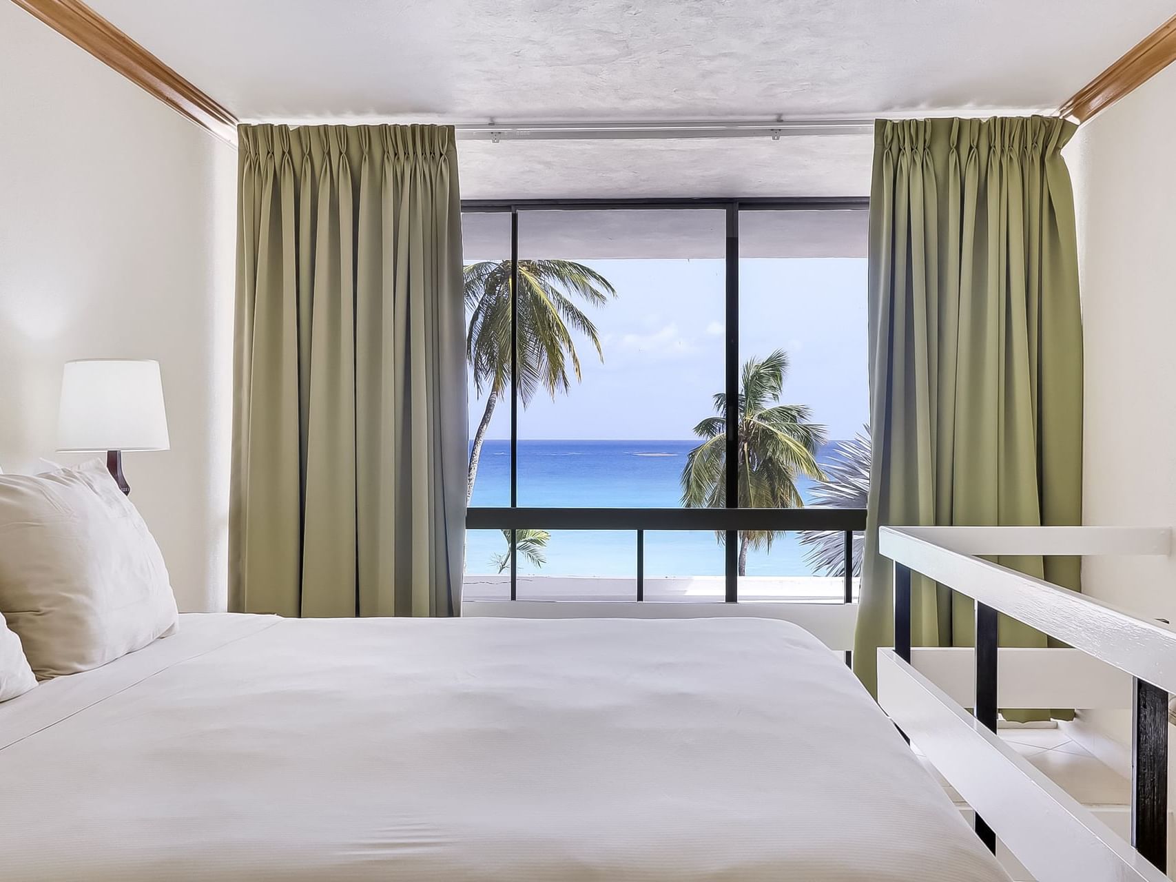 King bed in Luxury Suite with ocean view at Southern Palms