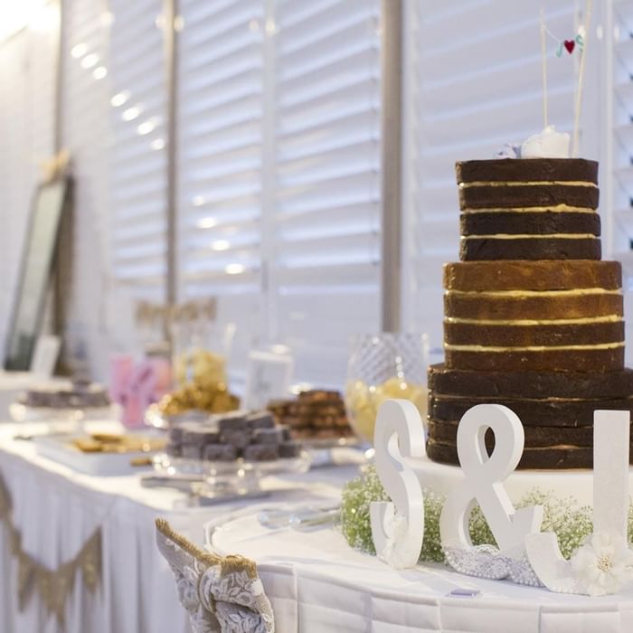 Wedding cake with chocolate and vanilla layers, accented by decorations at Mercure Hotel Townsville