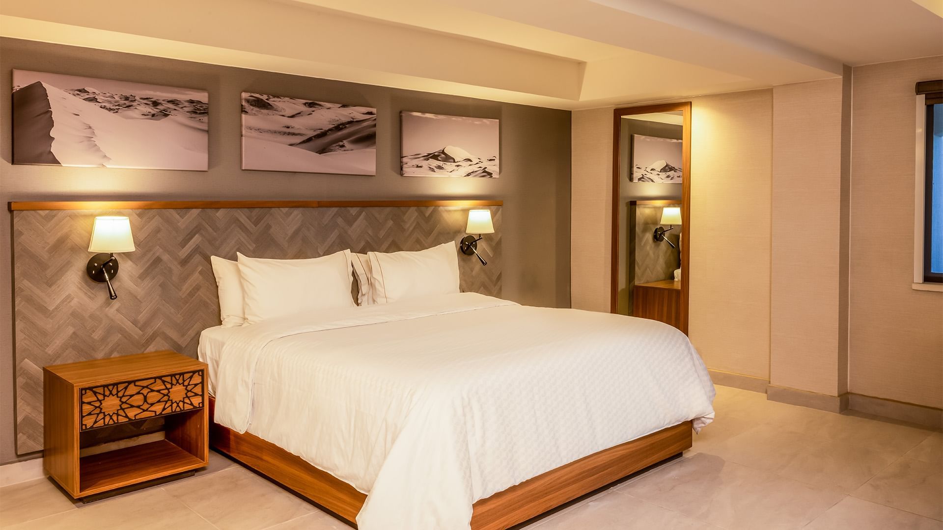 Large comfy bed in hotel room at Gamma Ciudad Juarez