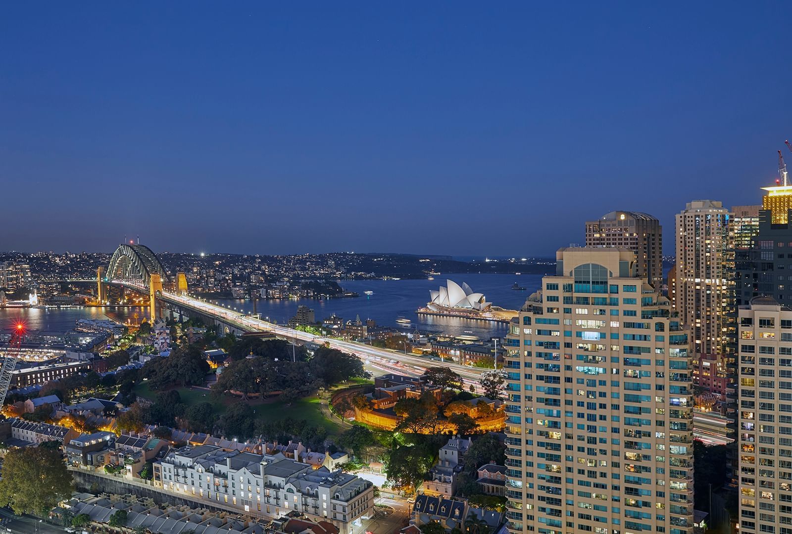 Aerial view of the city and river near Crown Hotels at dusk