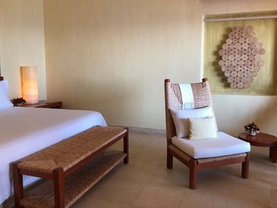 Lounge chair in Cliffside Ocean Front Suite at Cala de Mar