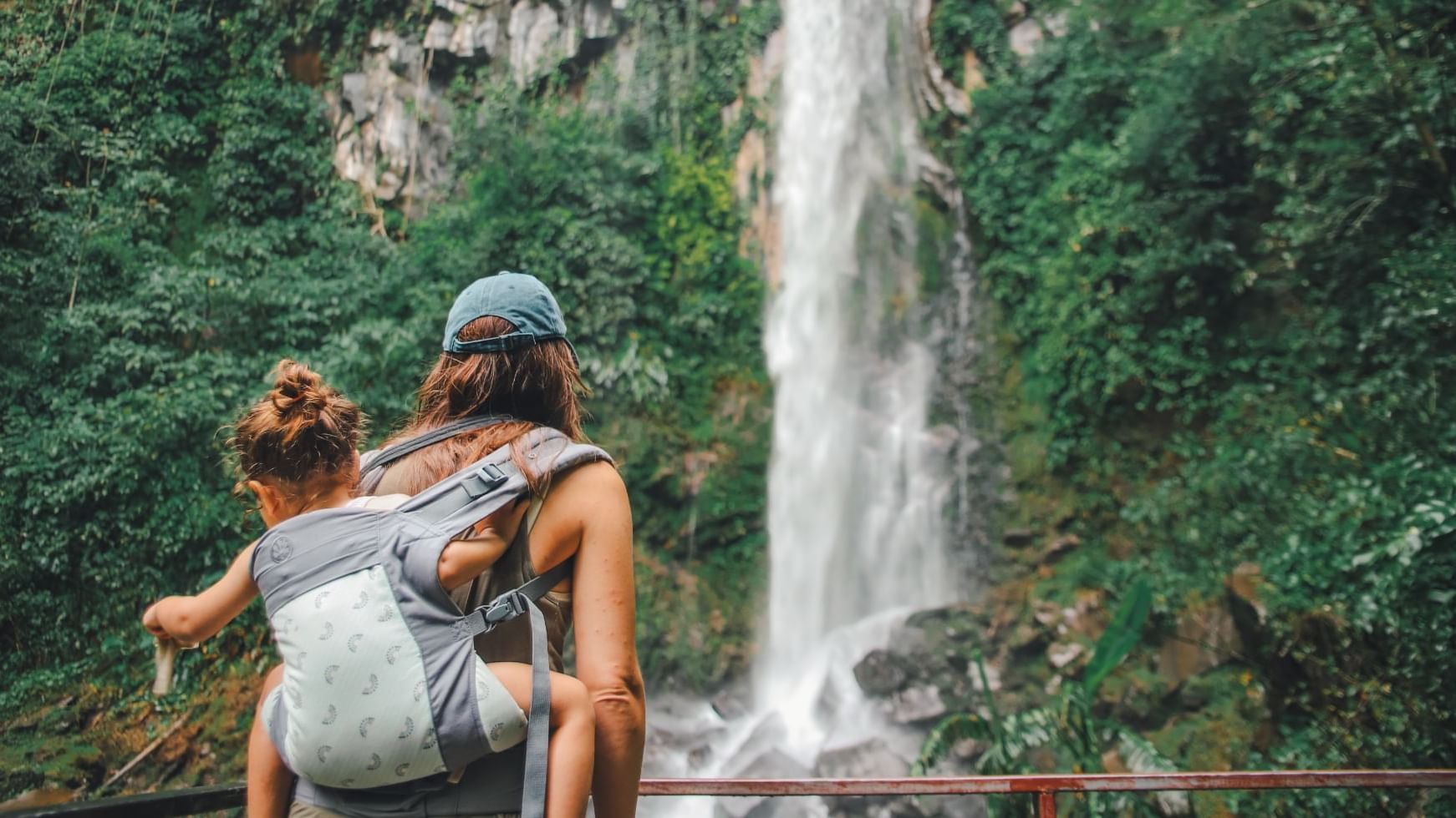 Mother & kid by a waterfall near Buena Vista Del Rincon