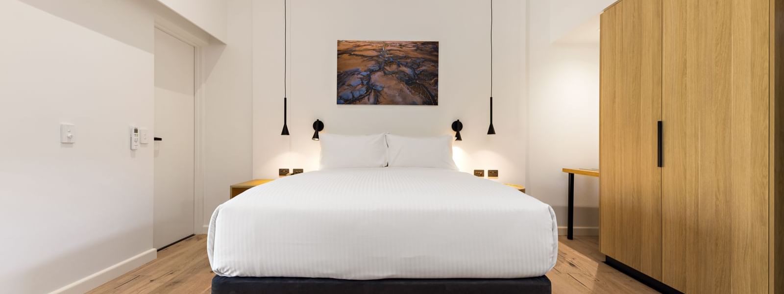 Bed in the Deluxe Queen Room at Mercure Darwin Airport