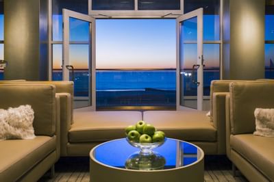 Lounge area by sea view from spa room at Ocean Place