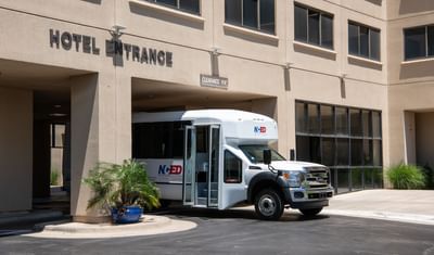 Hotel shuttle parked at NCED Hotel and Conference Center