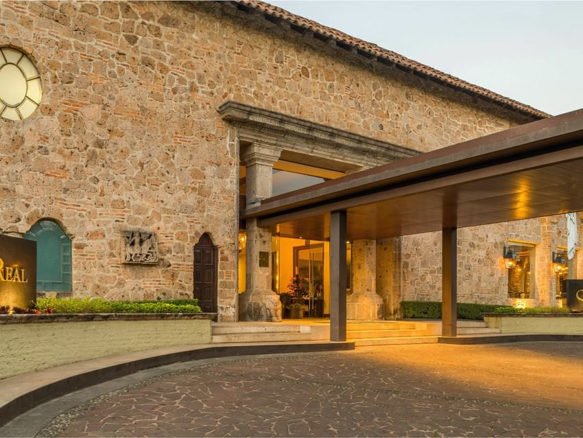 Exterior stone facade and grand entrance canopy at Quinta Real Guadalajara