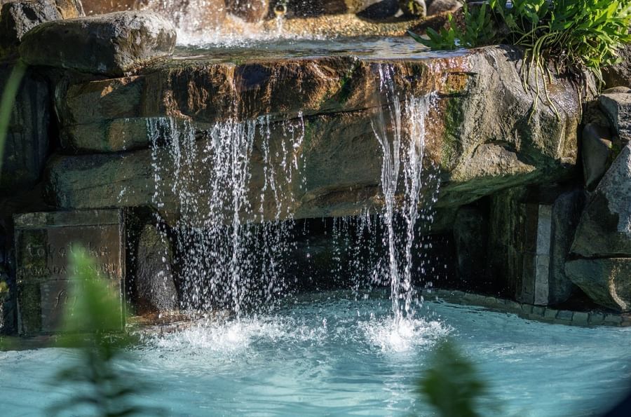 Water flowing down rock wall into pool at Tokatoka Resort Fiji International Airport.