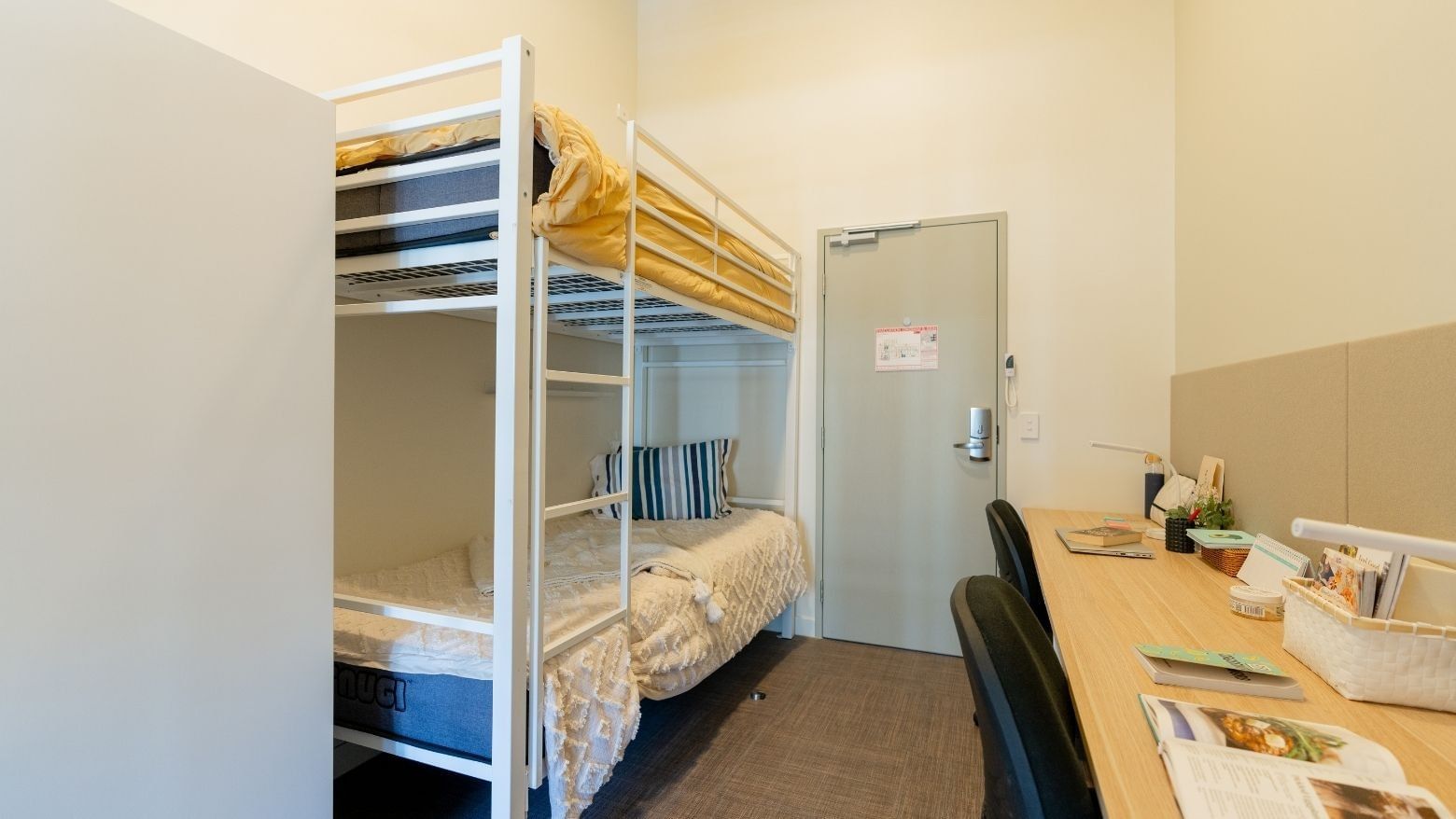 Bunk Room Twin Share with bunk beds and two desks at UniLodge Herston room.