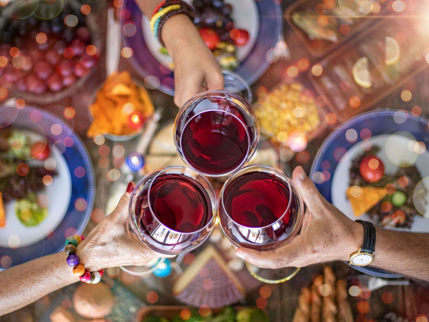 High-angle view of people toasting wine at La Galerie Hotel