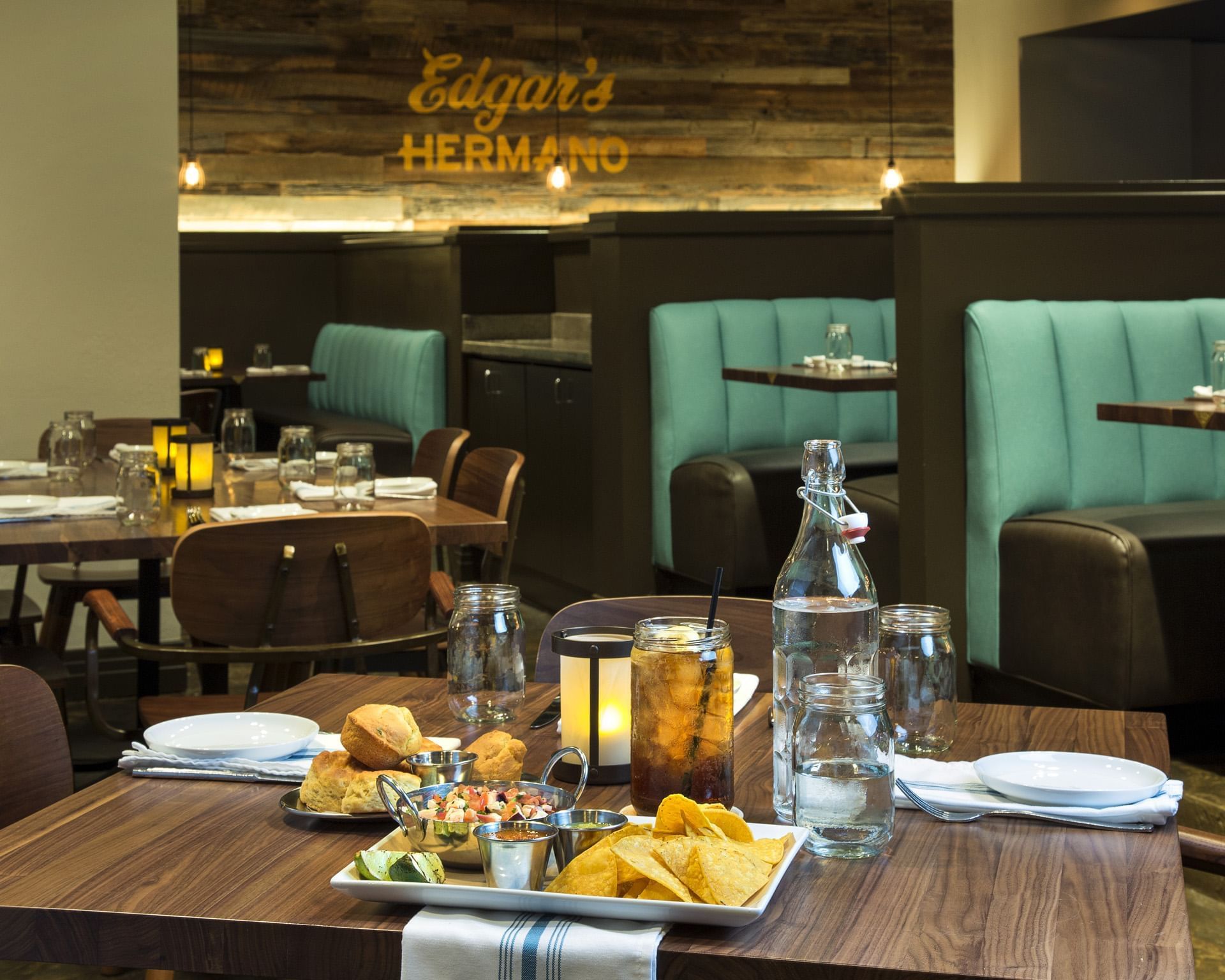 a restaurant dining area with a table set for guests