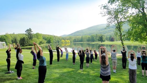 People engaged in outdoor exercise session at Honor’s Haven Retreat