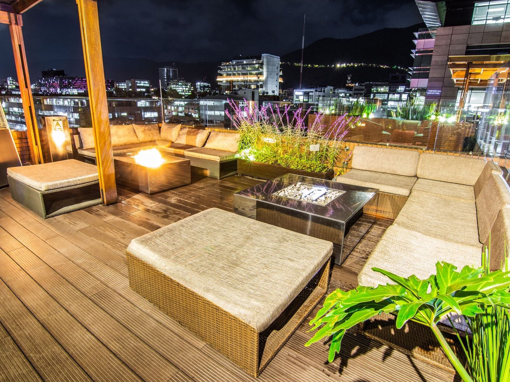 Night view of the outdoor chilling area at the rooftop with lights 