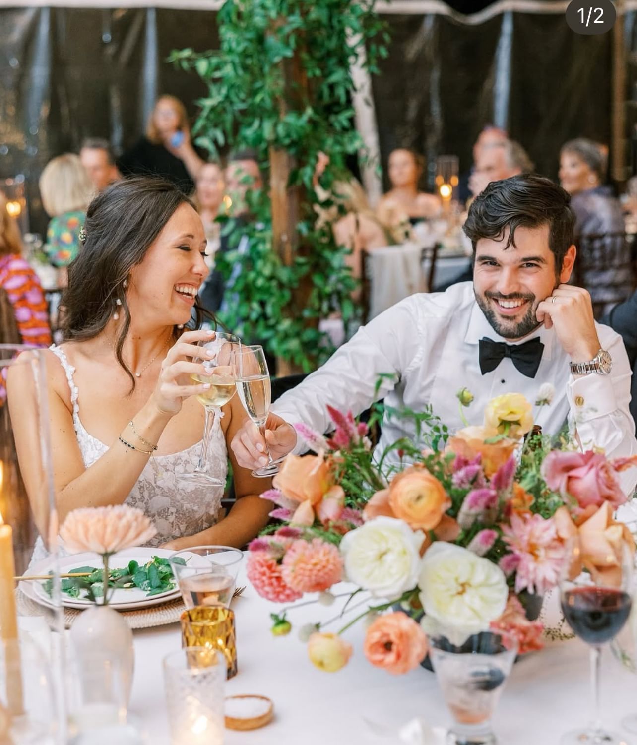 Bride and groom clink glasses at their wedding reception at The Clifton Hotel in Charlottesville, Virginia.