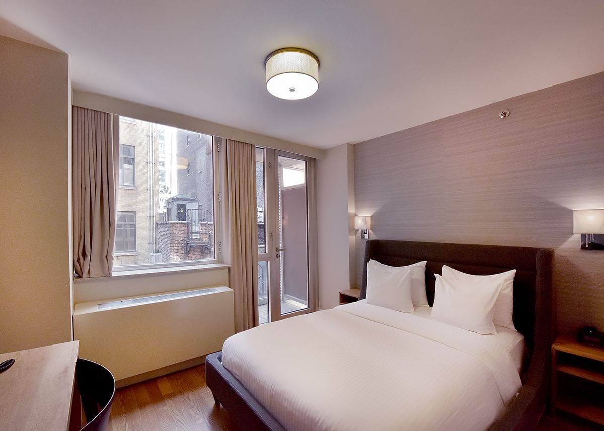 Image 31: Comfy bed & balcony with city view in Full Superior at Hotel 32|32